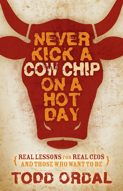 Book cover image for Never Kick a Cow Chip on a Hot Day ISBN: 9781630477202