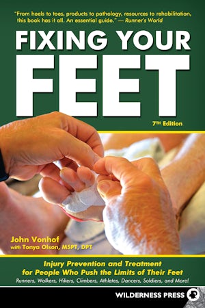 Book cover of 'Fixing Your Feet' with hands holding a foot, on a green and orange background.
